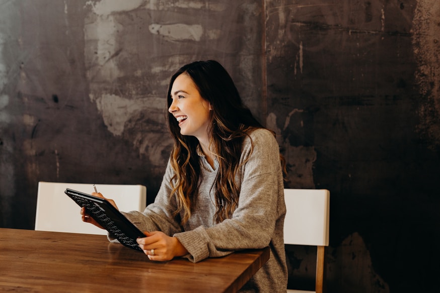 Woman holding a tablet in a meeting room
